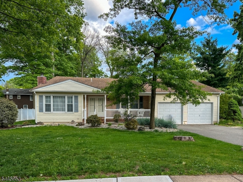 GREAT NEIGHBORHOOD - WOODLAKE, PISCATAWAY - ** Multiple Offers - Please submit highest & best offers by Thursday, July 16 at 5 pm. **Well-cared-for 3-bedroom, 2 full and 1 half bath ranch/split-level that feels warm and welcoming from the moment you arrive. Inside you'll find a comfortable living room with a fireplace, a generous dining room for gatherings, a spacious family room just off the eat-in kitchen, a full, dry basement, and an attached 2-car garage all on approximately one-third of an acre. WAIT UNTIL YOU SEE THE SUNROOM. Bright and inviting, it features a vaulted wood ceiling, a wall of windows, and peaceful views of the covered deck and lush, fully fenced backyard with an established lawn and professional sprinkler system. It's the kind of room you'll find yourself coming back to, morning coffee in hand or simply enjoying the view. Woodlake is one of Piscataway's established neighborhoods, known for its winding, tree-lined streets and sidewalks. You're just minutes from I-287, the NJ Turnpike, Garden State Parkway, Routes 1, 18, and 27, Edison Station with direct service to NY Penn Station, Rutgers University, Johnson and Donaldson Parks, and extensive shopping and dining. Easy to show. Quick closing OK.