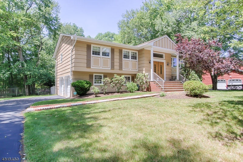 Welcome to this bright and sunny home situated in the Brittany Park section of Montville. Conveniently located at the center of town walking distance to High school, library and places of worship. First level has nice size kitchen with granite tiled counter top open to dining room. Living Room, Master Bedroom with attached bath and 2 other bedrooms with an additional bath complete this level. Hardwood flooring underneath all bedrooms. Ground level features a family room, with sliders to the outside yard, an additional bedroom, powder room and laundry room with access to the garage makes this a great layout. Backyard is perfect for entertaining for those hot summer days with an in ground pool and nice size 2 tired deck. Newer roof, gutters, furnace, hot water heater, windows and air condition.