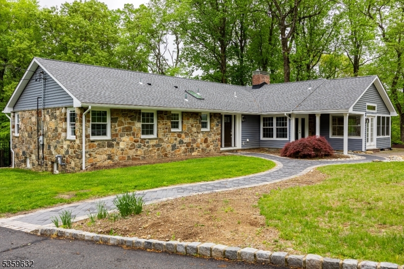 Welcome to this fully renovated, move-in ready ranch-style home w/ 4 bedrooms & 3 full bathrooms, set on over 3 private, scenic acres in the heart of Chester Township. Thoughtfully updated, this home blends classic charm w/ modern finishes, offering single-level living with bright, open-concept spaces designed for comfort & style. The custom kitchen features high-end appliances, and a layout perfect for cooking and entertaining. Throughout the home, enjoy refinished hardwood floors, updated bathrooms, and new windows that fill the space with natural light. Major upgrades include new siding, roof, plumbing, electrical, and an HVAC system with a high-efficiency boiler. Both the main house & detached building benefit from updated septic systems. The finished lower level, with a private entrance, is currently used as an au pair suite ideal for , guests, or a in law suite  setup. Step outside to your private backyard oasis w/ a renovated in-ground pool featuring new plaster, plumbing, & equipment ideal for entertaining. The expansive lot offers plenty of space for recreation, gardening, or quiet enjoyment. A detached second building adds flexibility as a possible guest house, office, studio, or workshop. Located minutes from top-rated schools, downtown Chester, parks, shopping, & commuter routes, this property offers a rare mix of modern systems, flexible living space, & peaceful surroundings a truly turn-key home in one of Morris County's most desirable areas.