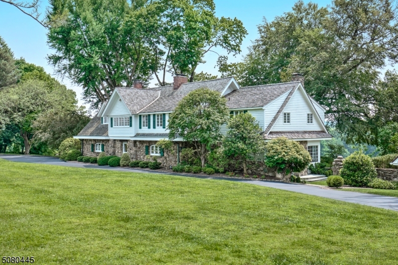'INDIA BROOK' - A CLASSIC HOMESTEAD in Mendham Borough embodying 23+ acres of farm assessed land held in 2 contiguous parcels and offering a collective of living accommodations and outdoor pursuits. The property's centerpiece is a graceful 5 BR / 4.1 BA Colonial ca.1920 with many authentic details. Magnificent great room with river rock wall overlooks perennial gardens, gourmet kitchen and stunning views from every room! A cathedral ceiling studio and workshop includes a full bath. The 2 BR/1 BA storybook cottage features a full kitchen with living and dining rooms. Previously used to raise thoroughbreds, the 6 stall barn with tack room includes rented 1 and 2 BR apartments above; each with a kitchen and full bath. A 170' x 23' vehicle barn and 4 run in sheds dot this bucolic landmark offering versatile uses