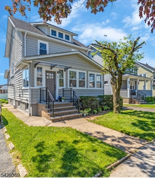 Move right into this beautifully renovated 3 Bedroom, 2 1/2 Bath Colonial in a prime Roselle Park neighborhood. Enter through a large three-season porch, outfitted with stunning luxury vinyl plank flooring and charming bead board ceiling. The entryway, with built-in storage, is an ideal drop zone for daily essentials. A substantial living room, with contemporary custom panel walls, is a perfectly appointed entertaining space, outfitted with an exquisite, brand new full bath that adds both style and convenience. The spacious dining room with elegant crystal chandelier flows right into the designer kitchen with quartz countertops, shaker cabinets and brand new stainless steel appliances. Head upstairs to find another stunning full bath and three sizable bedrooms, all with brand new windows and floors and generous closet space. A brand new modern ductless climate control system throughout the home adds efficient heating and cooling. An oversize walk up attic, along with a substantial basement with updated half bath, separate workroom and epoxy floor, add generous finishable square footage with endless possibility! The meticulous craftsmanship inside the home sets a tone of timeless luxury and elegance, while outside, yard fencing and detached garage with finished floor allow for privacy and added convenience. Perfectly positioned less than a mile from the train station, schools, shops and restaurants.