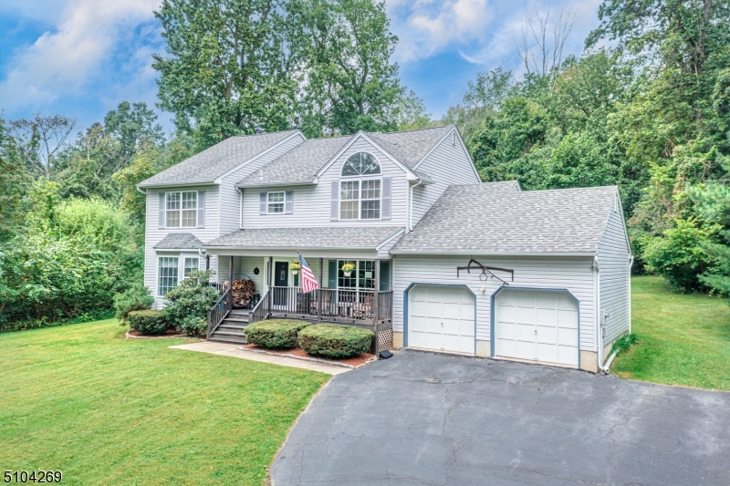 Meticulously Cared for Center-Hall Colonial in Desirable Colonial Oaks Neighborhood! This home is situated on a secluded, premium lot that is just under 1.25 acres. Take in the serene sounds of nature from your beautiful front "Lemonade Porch". The interior features include: A Grand Foyer with Curved Staircase, Master "En-Suite" with Vaulted Ceilings and Large a Walk-In Closet, and a Massive Finished Basement equipped with a Full Bar for Entertaining! Roof was Replaced about 3 Years Ago. Close Proximity to Mountain Creek Ski Resort, Crystal Springs Golf Resort, Hiking, Lakes, Wineries, Farms and so much more! 60 Miles to NYC! A Must See!!!