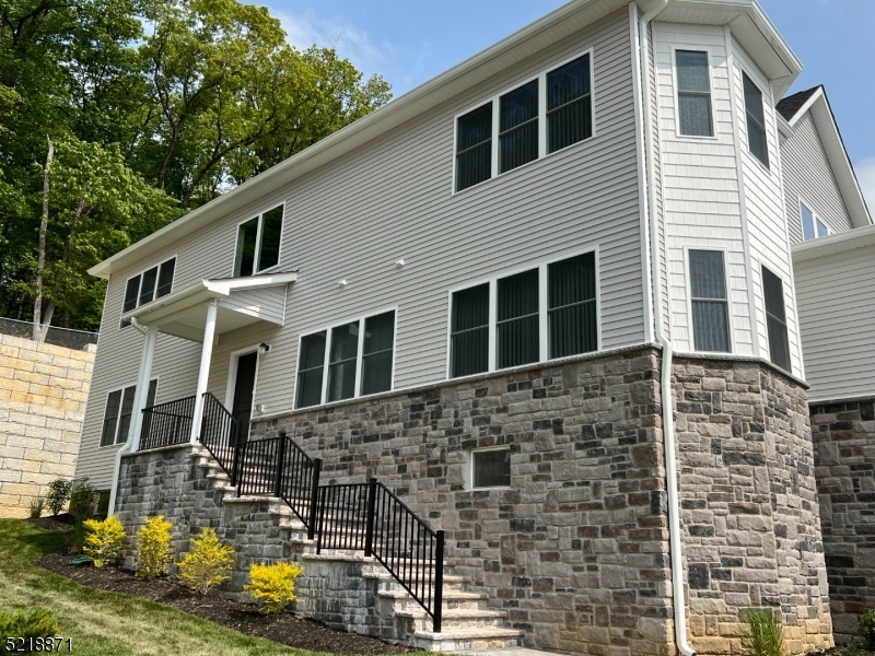 NEW CONSTRUCTION INTERIOR UNIT!  Mountain Way Estates, located in Parsippany, NJ is composed of luxury living newly constructed townhomes.  This ideal location, while nestled in the mountain landscape of Morris County is also a commuter's dream - close to various NJ transit buses and trains, and all major highways, including Route 287, Route 46, and Route 10 - you are only 30 miles away from New York! This 4-bedroom, townhome features a spacious floor plan extending from just under 4,000 square feet. A full unfinished basement houses a washer and dryer unit and endless possibilities for storage or entertaining.  This luxurious townhouse is equipped with a wide array of luxury living upgrades, including chef-inspired contemporary kitchen with granite countertops. All modern stainless-steel appliances " including a dishwasher, refrigerator, oven and microwave.  The first floor is home to one bedroom, and upstairs you will find three more generous sized bedrooms.  Hardwood flooring throughout the first floor, stairs leading to the second floor and second floor hallway.  Bright and airy ambiance with neutral colors.  Other amenities include individually controlled central heat and air conditioning, in-unit washer and dryer, and a TWO CAR garage.  Community amenities are amazing, as well as those who appreciate luxury, safety and convenience. Mountain Way Estates comes with a 24-Hour Emergency maintenance service. Cable-ready with Verizon FIOS available.  THIS WON'T LAST!!!