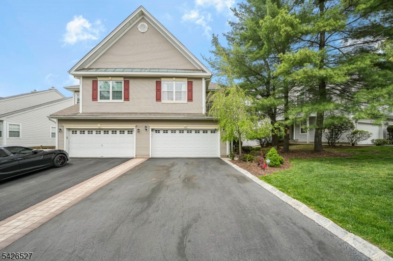 Welcome to the one you've been waiting for   where breathtaking treetop views, soaring ceilings, and sun-filled living spaces come together in one stunning end-unit townhouse!Located in one of Wayne's most desirable communities, this spacious 4-bedroom, 2.5-bath end-unit townhouse offers the perfect blend of comfort, space, and style. Step inside to soaring vaulted ceilings, gleaming hardwood floors, and dramatic floor-to-ceiling windows that flood the home with natural light while showcasing picturesque wooded views. The open-concept living and dining areas create an inviting flow perfect for everyday living and entertaining alike.The spacious primary suite features vaulted ceilings, oversized windows, and a large ensuite bath complete with a soaking tub, stall shower, and dual vanity. Generously sized bedrooms, an in-unit laundry room, and abundant storage throughout add to the home's functionality. The full walk-out basement offers endless possibilities for additional living space, recreation room, gym, or home office.Enjoy peaceful mornings and relaxing evenings from the private deck overlooking beautifully landscaped surroundings. Additional highlights include a 2-car attached garage and the added privacy that comes with end-unit living. Conveniently located near shopping, dining, parks, major highways, and NYC transportation. A rare opportunity to own a bright and spacious home with exceptional views in the heart of Wayne!