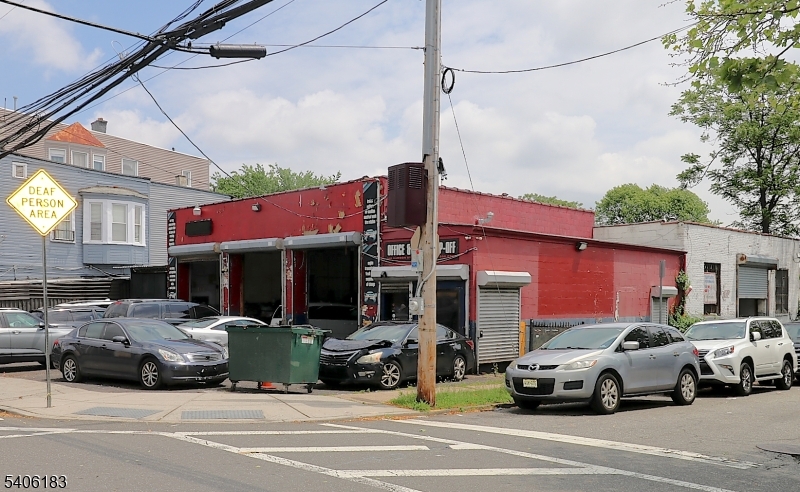 Welcome to this prime corner commercial property located in the sought-after University Heights section of Newark's Central Ward. This is an excellent opportunity to own a fully occupied mechanic shop investment property situated at the corner of Hudson Street and Hartford Street.The property features two tenant-occupied mechanic shop spaces. The Hudson Street side offers approximately 2,200 square feet plus an additional 300 square feet of office space. The Hartford Street side features approximately 1,500 square feet. The building also includes three half bathrooms.Property highlights include R-4 Residential Low-Rise zoning, a 60' x 100' lot size totaling approximately 6,000 square feet, and a building size of approximately 4,000 square feet. Conveniently located near major highways, Downtown Newark, Rutgers University, NJIT, University Hospital, and public transportation, with easy access to New York City.Business not included in the sale.