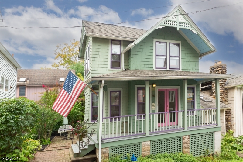 Step into the timeless charm of this Victorian gem in the heart of historic Mt. Tabor. From the moment you arrive at the welcoming front porch, this home invites you to enjoy its character and unique spaces. The front living room exudes warmth and openness, with a cozy nook to the left perfect as a reading corner, parlor, or quiet retreat. The dining room offers the ideal setting for entertaining, while the bright kitchen features ample cabinetry, natural light, and a convenient door that leads directly to the private patio and lush garden, creating a seamless indoor-outdoor flow. Upstairs, the primary bedroom includes a versatile sitting area that may have once served as a third bedroom, and it offers direct access to a charming porch an inviting spot to unwind on beautiful evenings. The second floor also showcases a beautifully updated full bath with stylish tile flooring you'll love, along with a light-filled second bedroom offering peace and serenity. Beyond the home, enjoy everything the Mt. Tabor community is known for: two parks, a vibrant library, events in the historic Tabernacle building, and the option to join the local golf course. Just a short walk to the train, restaurants, and shops, this neighborhood is beloved for its sense of community, history, and walkability. This is more than a home it's a lifestyle, blending Victorian character with modern updates in one of the area's most sought-after settings.