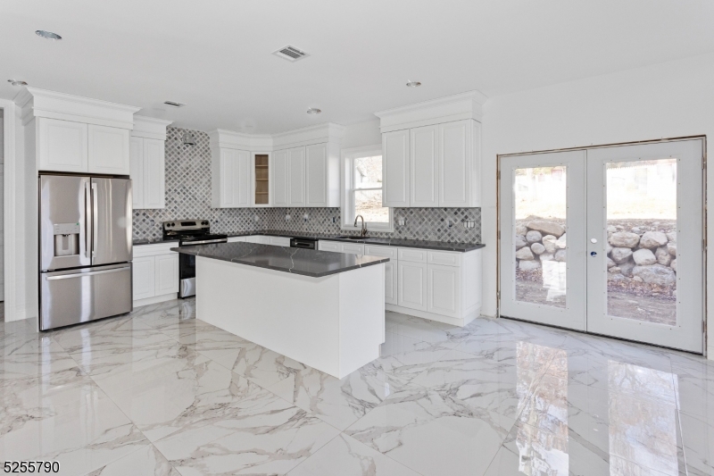 Welcome to this incredible and rare Custom Built New Home Construction. Situated on over 1/3 acre in desirable lake community of Hopatcong. Custom 4 Bedroom, 3 full bath Colonial with over 3400 sq ft of living space and an additional 1446 sq ft unfinished basement - customize to meet your needs, home gym, playroom, cozy home theatre.  Cultured stone and Vinyl siding exterior. Hardwood flooring and recessed lighting throughout. Exceptional craftsmanship - custom details/upgrades. First level offers Two Story Foyer, Living Room, Great Room, Gourmet Kitchen with pantry, Breakfast room, Dining Room, Office plus Study/Den/BR and Laundry Room. Potential in law suite on first floor. Second level features Master Bedroom Suite with walk in closet, luxurious master bath, three additional bedrooms and full main bath. Welcome to the largest freshwater lake in New Jersey! Situated less than an hour from the heart of NYC, a perfect retreat for those who want city access and suburban tranquility.  The nearby Mahlon Dickinson Reservation offers a wealth of outdoor activities including hiking, boating, swimming! A rare opportunity for quality new construction -  this custom Colonial has it all.