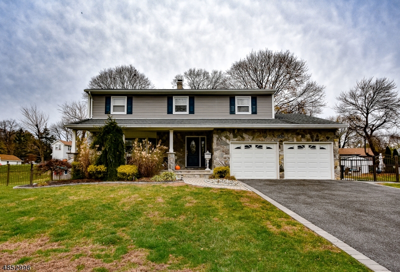 If you're on the fence about buying, jump on over to this home quickly? It's impeccably maintained both inside and out!  The first floor offers hardwood flooring throughout the living room, dining room and kitchen, along with 'wood-look' tile in the family room.  High hat lighting brightens up rooms and nicely accents the crown molding.  The Gourmet Kitchen features all granite counter tops, a Wolf Cooktop, double oven, wine fridge and two-tier center island for both food prep functionality and entertaining.  The master bedroom offers an updated master bath with stall shower, as well as a walk-in closet.  Other amazing features include a full finished basement with stadium theater and a huge deck with two TV's, along with an outdoor kitchen.  All this located on a quiet, Cul-de-Sac street in town!