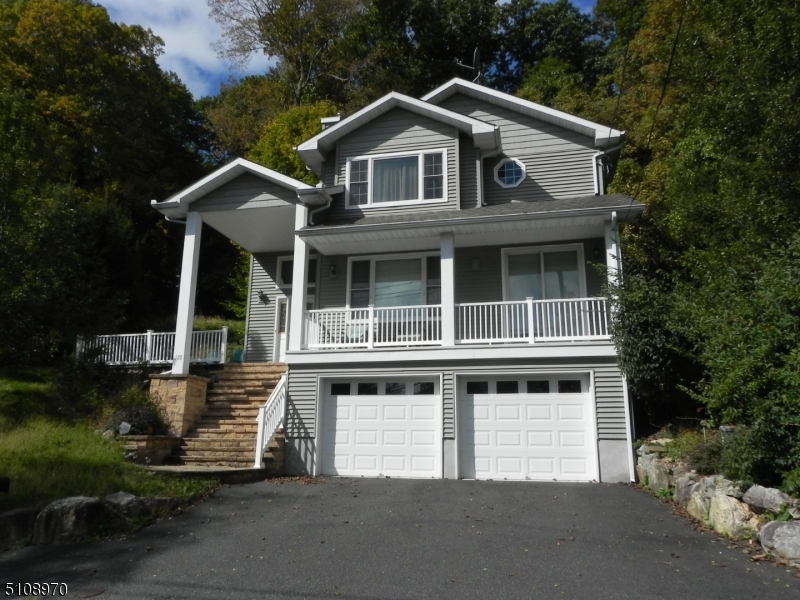 Escape to the Lake! Beautiful, Young, custom built, colonial, lakefront house with 2 car garage. Dock and boathouse included in the sale.Gorgeous updated Kitchen with granite counters. Updated bathrooms. Beautiful lake views. Quiet and serene. Crescent Cove beach membership is optional.