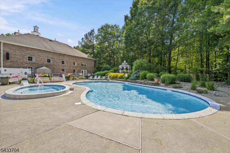 A rare find in the heart of West Milford's premier 55+ active adult community! Welcome to Unit 302 at Bald Eagle Commons, featuring the highly sought-after and rarely available Williamsburg model. As the largest floor plan offered in the community, this well-maintained 2-bedroom, 2-bathroom residence stands out even further as a desirable END UNIT, providing extra natural light and enhanced privacy. Life at Bald Eagle Commons feels like a year-round vacation. The community boasts an incredible array of amenities, including a lively clubhouse, an outdoor swimming pool, a fully equipped fitness center, a cozy library, a crafting room, and multiple gathering spaces. Stay active on the tennis and bocce ball courts, or enjoy a peaceful stroll along the scenic walking paths. Best of all, an on-site social director handles a consistent calendar of activities and events, making it effortless to meet neighbors and stay engaged.Convenience is unmatched with a dedicated parking spot located in close proximity to the building, an assigned separate storage unit for seasonal items, and easy access to local West Milford shopping and dining options just minutes away.This unit is an excellent opportunity to secure the community's premier layout and customize it to your personal taste. Please note this well-maintained unit is an estate sale and is being sold in as-is condition. Bring your vision and make this grand space your own!
