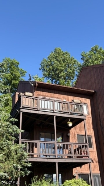 Unique Corner Condominium Unit etched into the Mountain Creek Ski Mountain with stunning Sunsets you won't believe. This duplex 2 bedroom, 2 bathroom country retreat is an end unit with an extra large corner deck overlooking Minerals Resort and ski area that is sure to take away the stress at the end of a workday. See photos and hurry to tour this unique layout and corner unit. All amenities including washer /dryer, dishwasher, central heat and air-conditioning. Two car parking right outside your door in a secure gated community. Come and live your life devoid of stress. The sunsets can not be overlooked, see photos! The Photo of the Northern Lights was just this year!