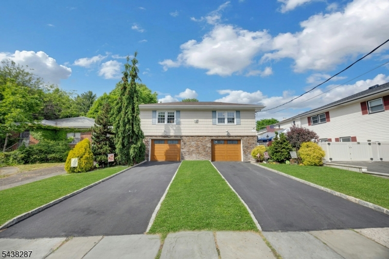 Set in the heart of Rutherford, this spacious 4-bedroom, 3-bath split-level home offers the comfort, flexibility, and location buyers have been waiting for. With multiple living areas and a thoughtful layout, the home offers flexibility for everyday living, entertaining, working from home, hosting guests, or creating a private first-floor living space.The first-floor bedroom, full bath, family room, and private entrance provide excellent versatility for guests, in-law suite use, or a separate work-from-home setup. Inside, hardwood floors, crown molding, recessed lighting, skylights, central air, and a wood-burning fireplace create a warm and inviting feel throughout. The partially finished full-size basement adds even more room for storage, recreation, or future use.Outside, enjoy a fully fenced backyard with a koi pond, plus the convenience of an attached 2-car garage. Just moments from NJ Transit bus service to NYC, Rutherford Station, Park Ave shops and dining, Felician University, and Rutherford schools, this home offers a rare combination of space, flexibility, and small-town convenience in one of Bergen County's most beloved communities.
