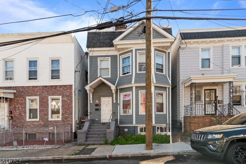 Multi family home with 6 bedrooms 2baths, parking and a full finished basement and separate utilities. Parking in the back of the house. great for rental income.