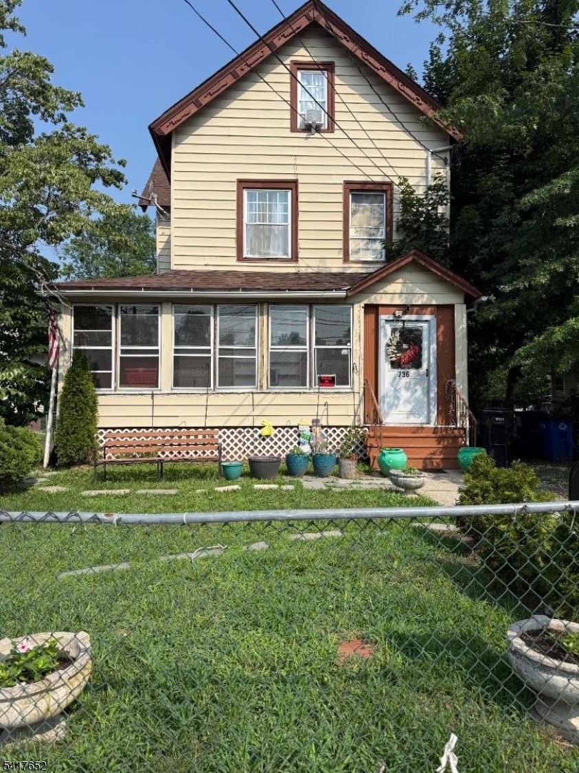 Welcome to 736 W. Front Street, Plainfield! This spacious 5-bedroom, 2 full bath Colonial offers the perfect blend of character, space, and opportunity. Featuring three finished levels of living space, this home provides generous room for a growing household, or a work-from-home lifestyle. Step into the enclosed front porch, a perfect place to relax year-round, before entering the home's spacious interior with large rooms. The full walk-out basement offers excellent storage and endless possibilities for a recreation room, workshop, home gym, or additional finished living space. Outside, enjoy an oversized driveway with ample off-street parking and a deep backyard that backs to OPEN Space, providing privacy and plenty of room for entertaining, gardening, or outdoor activities. Conveniently located near downtown Plainfield, NJ Transit Bus, train stations, major highways including Routes 22, 28, and I-78, shopping, restaurants, parks, and schools, this home offers an ideal location for commuters while keeping everyday conveniences close by. Whether you're searching for a spacious primary residence or a home with incredible potential, this property is one you won't want to miss. Home is being sold strictly AS IS.