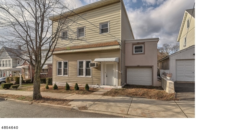 THE "SAVVY INVESTOR" LOOKING TO LIVE IN ONE UNIT & RENT OTHER Spacious 2 Family offering a completely renovated main floor unit with new Kitchen enhanced with granite, SS appliances and new modern bath, 3 bedrooms, Living/Dining Rm combo, hardwood floors, laundryhook-ups, Family Room, 3rd bedroom is separated by a 1/2 flight of stairs. The second floor is beautifully updated  with new bath, updated eat-in  Kitchen with granite counters, tile floors and SS appliances. Living Room with original mouldings and decorative fireplace, 2 spacious bedrooms and sleek modern bath. Additional features include, freshly painted interior, 1 car garage and driveway, large level yard and separate utilities.
