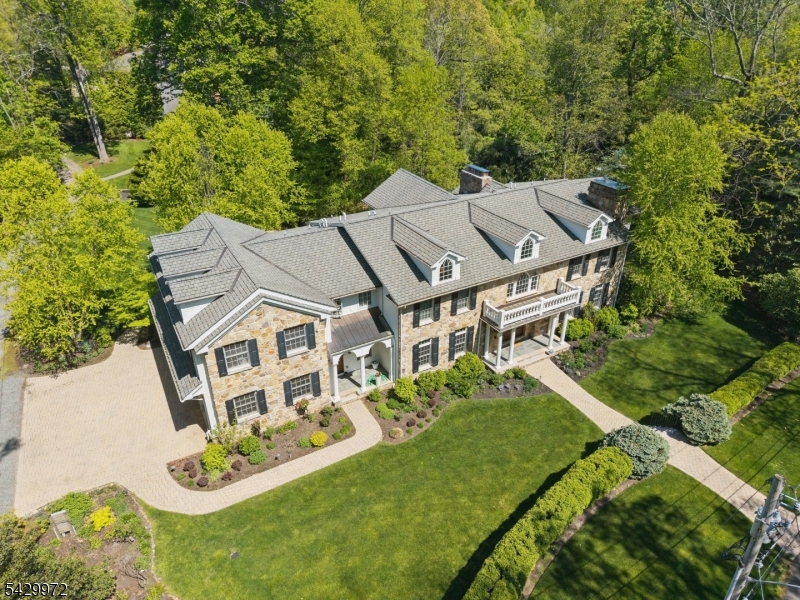 Simply magnificent! Grand Colonial custom built in 2007 features almost 10,000 sq ft of luxury living space including a massive 2-story entrance hall & 2-story great room w/ gas FP totally open to the gourmet eat-in kitchen w/ 6 burner Wolf gas cooktop, Wolf wall ovens & 2 Subzero refrigerators. There is a sunroom w/ 3 exposures & French door to terrace, stunning formal dining room & home office with gas FP. 2nd level features a luxurious primary suite w/ gas FP, WIC, a bright office & spa-like primary bath w/ Jacuzzi, oversized shower & radiant heated floor. 4 more bedrooms on 2nd level w/ 3 more full baths, all with radiant heated floors, & laundry room. Beautifully finished lower level w/ abundant natural light, 2 sets of French doors provide walkout access, & has state-of-the-art movie theater w/ 4K Projector & 8 chairs, rec room, exercise room, 6th bedroom & full bath w/ steam shower! Attached 3-car heated garage w/ easy 1st floor access from mudroom. Incredible amenities including a generator, 4 huge gas FPs, 5 zone HVAC, whole house sound system controlled by phone w/ exterior speakers, central vacuum, wired 9 CCTV camera security system by ADT, underground sprinkler system, front & back landscape lighting, & radiant heated floors in all 4 bathrooms on 2nd level! Spacious deck runs the length of the back of the house, great for everyday use & entertaining. Ideally located on a quiet private road in Hartshorn Elementary School district, just 0.5 miles from the school!