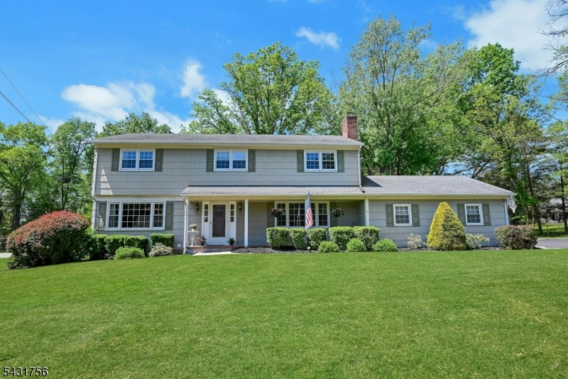 Set in one of Bridgewater's most sought-after neighborhoods, this spacious 5-bedroom, 2 full and 2 half bath colonial combines classic charm with thoughtful updates and an ideal location. You are greeted by a covered front porch, and enter to discover a formal dining room and formal living room with fireplace, both accented by large picture windows that fill these spaces with natural light. The updated kitchen is designed for both everyday living and entertaining, featuring expansive granite countertops, a wine fridge, abundant cabinetry, and an oversized center island/breakfast bar that offers generous seating, storage and work space. Just beyond, the inviting sunroom features peaceful views of the private backyard with mature trees and a patio perfect for relaxing or outdoor gatherings. A spacious family room, updated powder room, and attached 2-car garage complete the main level. Upstairs, you'll find five well-proportioned bedrooms, an updated full hall bath with dual sinks and tub/shower combination, and a comfortable primary suite with an updated en-suite bath featuring a stall shower. The basement adds valuable flexibility with a powder room, laundry area, ample storage space and a dedicated workshop. Ideally located near major commuter routes, shopping, fitness centers, and the vibrant restaurants and nightlife of Somerville, this home also benefits from Bridgewater's top-rated school system making it an exceptional place to call home.