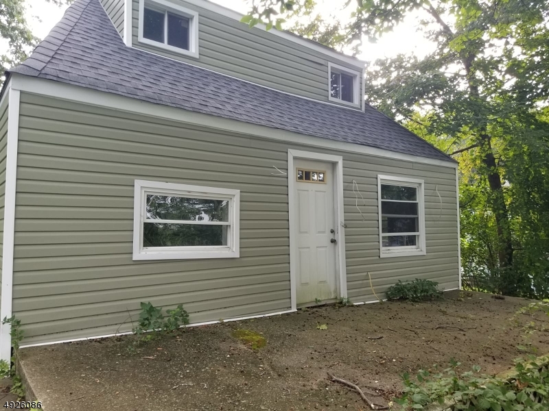 Calling all investors!!! Not a Foreclosure or Shortsale!! Seller has started renovations with new roof, siding, windows, and gutted the home but could not complete. Perfect to renovate or build on in the Lake Hopatcong Section of Jefferson Township.