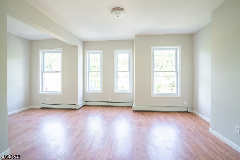 Stunning two Family in desirable area in Elizabeth is now available! Totally renovated 3 story, with first floor apt with 1 large bedroom, bath, living room, kitchen and access to finished basement with family room an office space. 2nd Apt consists of two levels, with a total of 3 bedrooms, and two full baths. Walking distance to train and major highways. Dont miss out this incredible investment opportunity with very affordable taxes!