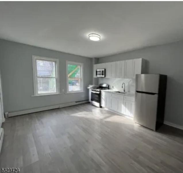 This inviting two-unit under-over multi offers an excellent opportunity for owner-occupants and investors alike. With some updates completed in 2022, this property is ready for you to add your finishing touches and start building equity and income. The lower-level unit features 1 bedroom, 1 full bath, a comfortable living room, and a functional kitchen ideal for rental or first time buyer. The upper-level unit offers 2 bedrooms and 1 full bath, a kitchen, and an open living and dining room combination, plus a walk-up attic that provides additional storage or future potential. Enjoy the convenience of both off-street and on-street parking. Whether you're looking to live in one unit and let the rental income offset your mortgage or add a solid property to your investment portfolio, this multi delivers flexibility and opportunity. Finish the updates to your taste, sit back, and collect the rents!