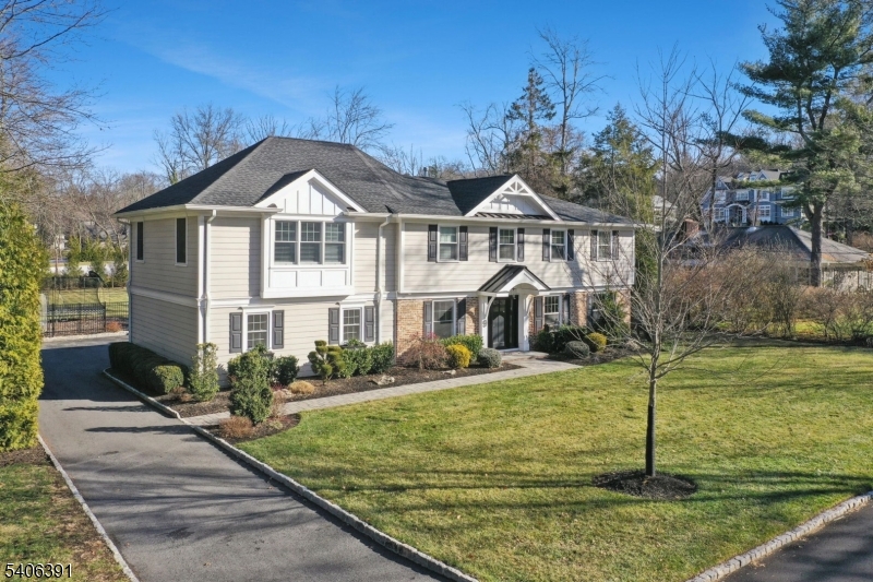 *STUNNING CUSTOM COLONIAL, PREMIER SHORT HILLS LOCATION* Completely renovated from top-to-bottom in 2021, this mint-condition 5BR, 4.5BTH home sits on 0.66 acres of  estate-like property in the heart of the Deerfield neighborhood. The thoughtful open floor plan has it all - sunny LR w/gas FP, banquet sized DR, amazing open kitchen family room: center island w/bar seating, quartz counters, professional grade appliances (Viking, SubZero, Bosch), bar w/wine fridge, modern linear FP in seating area, sliders to patio. A fabulous great room w/vaulted ceiling & gorgeous full BTH offers versatility & makes the perfect first floor primary or in-law suite if desired. Head upstairs to find 4 spacious BRs and 3 full BTHs. The primary suite features a vaulted ceiling, multiple walk-in closets & an ensuite bath w/heated floors, double vanity & glass shower. The other bedrooms feature custom closets, a jack-and-jill bath w/heated floors and an additional new full bath. A handy laundry room completes the second level. The lower level has a great rec room & tons of storage space.  Step outside & prepare to be wowed by the park-like, fully fenced property. With open lawns, mature plantings & a beautiful paver patio, enjoy your own private park in the heart of Short Hills. 9 Westview Road has it all - unpack your bags and move right in. Welcome home!