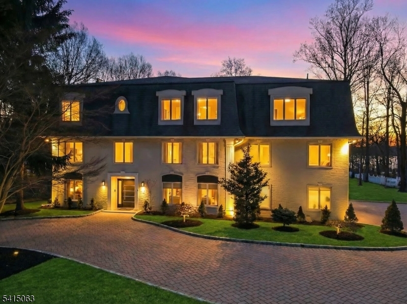 Welcome to 99 Ogle Rd, Old Tappan, a beautifully maintained and expanded brick Colonial set on nearly three acres with picturesque golf course views, located within the town's highly sought-after Blue Ribbon school district in one of Bergen County's most desirable communities. Spanning approximately 6,000 square feet, this impressive home offers a spacious and functional layout designed for both comfortable everyday living and elegant entertaining. Sun-filled interiors, generously sized rooms, and refined architectural details create a warm and inviting atmosphere throughout. Highlights include soaring cathedral ceilings, multiple fireplaces, and a gourmet kitchen with a large center island, quartz countertops, and high-end stainless steel appliances that flows seamlessly into the main living areas. The home also offers exceptional versatility with a private guest suite and multiple living and recreation spaces. Enjoy comfortable bedrooms, well-appointed baths, and ample storage throughout. The beautifully landscaped property provides space to relax, entertain, and enjoy the peaceful surroundings. Conveniently located near top-rated schools, parks, shopping, and major highways, this home presents a rare opportunity to own in prestigious Old Tappan.