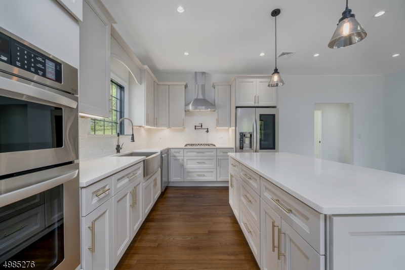 Located in the serene Oak Hills section of Boonton Township, this meticulously renovated open concept 3 bedroom, 2 full bath home will not disappoint!! The custom kitchen boasts gorgeous quartz countertops, LG Smart appliances and designer finishes incl. cabinet hardware, farmhouse sink, faucet, and pot filler. The master flows into the spacious master bath through the soft close barn door leading to a stunning shower!  If you are in search of something new and turn key without having to worry about maintenance for years to come, look no further. New features: oak hardwood floors, Andersen 400 windows, 4" recessed lights, roof, siding, electric (incl garage), plumbing, septic, HVAC & more. Optional Pool membership, low taxes, amazing Mtn. Lakes HS, close to downtown Denville, transportation & highways!