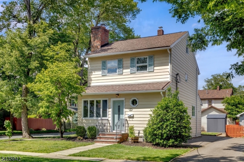 Welcome to 42 Johnson Avenue, a beautifully updated Colonial in Bloomfield's highly sought-after Brookdale neighborhood. Blending timeless charm with thoughtful modern updates, this move-in-ready home offers the perfect balance of character, comfort, and convenience. Filled with natural light, the home features freshly painted interiors and exteriors, recessed lighting, restored original parquet floors on the main level, h/w floors on the upper levels, and a finished basement with new flooring. Central air and steam heat provide year-round comfort. First floor offers spacious living room with wood-burning fireplace, formal dining room, kitchen with separate dining area, and convenient powder room. Second floor features three generously sized bedrooms and a full bath, while the third floor offers a versatile fourth bedroom ideal as a primary retreat, home office or dressing room. Finished basement provides valuable additional living space, perfect for gym, playroom, or office along with separate laundry room. Outside, enjoy a rare double-width driveway, storage shed, and expansive backyard with plenty of space for entertaining, gardening, and outdoor enjoyment. Ideally located near Brookdale's popular shops, cafes, restaurants, and beautiful Brookdale Park, just minutes from Montclair's renowned dining, shopping, arts, and entertainment, and with easy access to NYC bus which stops at the end of the block, this exceptional home offers the lifestyle today's buyers are seeking.