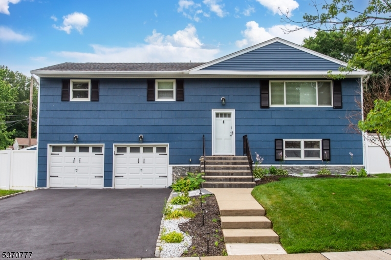 Step into one of the largest Bi-Level homes in sought-after Clover Hill beautifully updated and ready for its next chapter. This 4 bedroom, 2.5 bath gem sits on a fully fenced, corner lot with a lush, professionally landscaped yard, complete with a powered storage shed for added convenience. Inside, no detail has been overlooked. Enjoy a stunning new kitchen with stainless steel appliances, sleek finishes, and ample cabinet space. All bathrooms have been thoughtfully renovated, including the serene en-suite in the primary suite. Natural light fills the home, highlighting the updated flooring throughout. Downstairs, the bright, walk-out family room with sliding glass doors opens to a spacious patio, ideal for entertaining or relaxing in your private outdoor retreat. Homes with this size, style, and level of updates are a rare find in a great location with sought after schools!