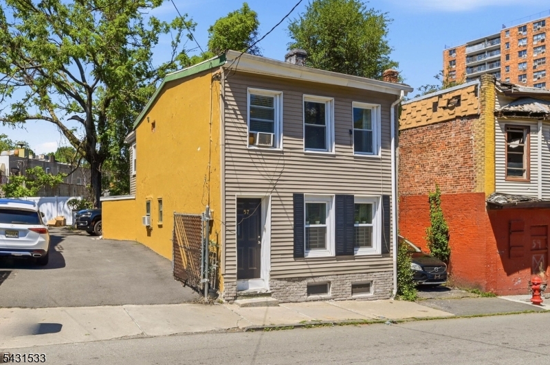 Exceptional Opportunity for Investors & Owner-Occupants in Paterson! Welcome to 57 Ryle Ave, a charming multi-family property offering the perfect blend of investment potential and owner-occupied flexibility. this well-located legal two-family home features  3 bedrooms and 2 bathrooms, making it an excellent opportunity for buyers looking to generate rental income while building long-term equity.Whether you are an investor seeking strong rental demand or a homeowner looking to offset your mortgage, this property delivers exceptional value. The property also benefits from its convenient location near local amenities, transportation, and major highways, making it highly attractive to tenants and commuters alike. An added bonus is the very low property taxes, helping maximize affordability and overall investment return.Offering endless possibilities to customize, renovate, or maximize returns. Don't miss your chance to secure this versatile multi-family property with both immediate income potential and future appreciation opportunities. Schedule your showing today!