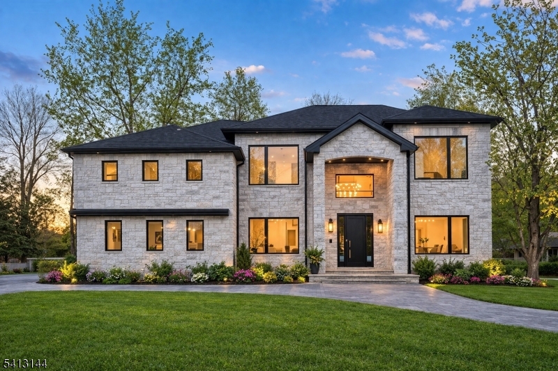 BRAND NEW EXQUISITE ARCHITECTURAL MASTERPIECE WITH OPEN CONCEPT NESTLED  IN THE COVETED COLLINS SECTION WITH TOP RATED SCHOOLS, THIS 7 BEDS 5,2 BATHS SMART ENERGY EFFICIENT HOME HAS IT ALL. The first floor boasts a soaring vaulted ceiling in the grand foyer with a pivot entry door  all open to the living room with Pella Windows and modern finishes overlooking the large formal dining room with a wet bar. Large -eat -in-kitchen with high-end stainless steel appliances, cabinet depth sub-zero refrigerator, wolf dual wall oven, dual dishwasher, double sinks, 8' inch Natural Oak wood floor, Center island all open to the  family room with fireplace overlooking the large chefs patio with a pizza oven with and a  guest suite with bath to complete. Striking Main bedroom Suite with seating area, closets, dual vanities, spa-like marble bath with soaking tub and a private all weather terrace. 3 additional bedrooms, two baths, custom closets and laundry complete the 2nd floor. One of the 3 additional bedrooms with ensuite bath. Finished lower level with 2nd guest suite / 6th bedroom, two full baths, 2nd family/ great room, gym with a glass walkout door overlooking the pavered patio and large manicured backyard. Fully integrated smart home system with security cameras and surround sound, Spray insulation for energy efficiency, pavered circular driveway, two Garage doors are smart car, Generator ready, whole house energy & noise efficient. Home was custom designed with attention to details.