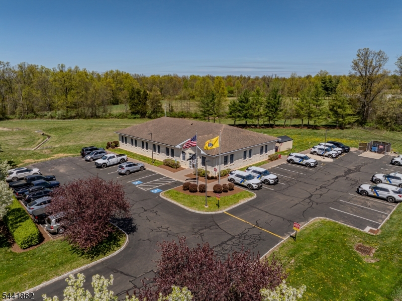 Currently a NJ State Police barracks with 40 parking spots including 2 handicap.  many possible uses as it is located in the kingwood Twp. Highway Commercial zone.  5,500 sq ft., building with room for expansion as the building sits on 8.3 acres.  Building has emergency generator capabilities.  Owner can provide Turn key Development.