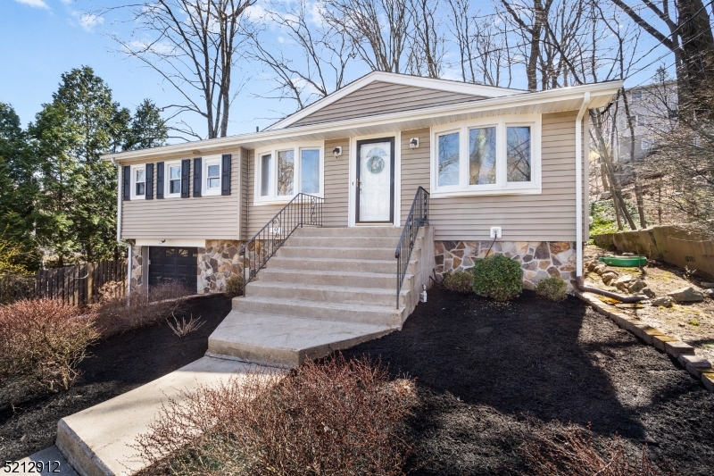 Enjoy the lake life in White Meadow Lake in this 3 bed, 2 bath ranch. This home is set back from the road with ample parking and features hardwood floors throughout the first level, large windows in living and dining room provide natural light, updated kitchen with stone counters, remodeled bathrooms (2023), central air,  and a large two-tier deck off of kitchen leading to a level yard. Finished basement has two additional living spaces and a full bath. WML also offers 2 pools, 6 tennis courts, athletic fields, clubhouse, lake access, playgrounds, year-round community events and easy access to Rt 80.