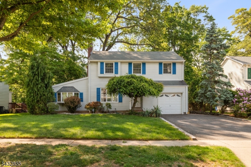 Well-maintained 4 bed, 1.5 bath home tucked away on a quiet street in one of River Edge's most desirable neighborhoods. Set on a beautifully landscaped property & wonderful curb appeal, the backyard borders Van Saun County Park w/ a large natural barrier of mature trees creating a rare, private & peaceful setting. A large 2 tier deck w/ newer French doors creates seamless indoor outdoor flow perfect for entertaining or relaxing. The 1st floor features a formal living room w/ wood burning fireplace, dining room, spacious kitchen & sunroom while creating an ideal layout for everyday living & entertaining. Filled w/ warmth & character throughout, the home features generously sized bedrooms, abundant natural light, hardwood floors, elegant wood trim, freshly painted interior, ample storage, large closets, finished basement providing additional flexible living space & an attached garage. As well as, an updated electrical panel & newer water heater. Conveniently located just 5mins. from the River Edge Train Station & close to Routes 4, 17 & the Garden State Parkway, this home offers easy commuting w/ the NYC bus to Port Authority down the street & the George Washington Bridge less than 9 miles away. Just minutes from highly ranked Roosevelt Elementary & River Dell Middle / High Schools, while also close to Bergen County Zoo, Veteran's Memorial Park, plus shopping & dining along Kinderkamack Rd, The Shops at Riverside Mall, Bergen Towne Center & Garden State Plaza. Don't miss out!
