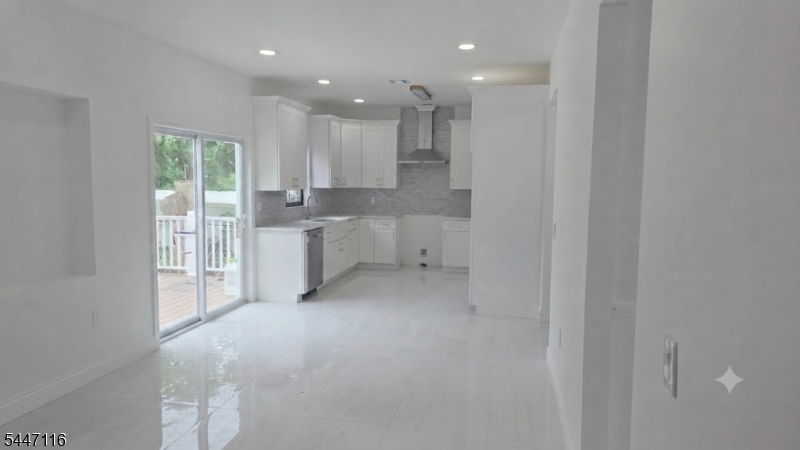 Welcome to this beautifully designed, nearly-new build detached home offering 5 spacious bedrooms and 3 full bathrooms. The open-concept living and dining area flows seamlessly into a generous kitchen featuring granite countertops and custom-designed cabinetry   perfect for everyday living and entertaining.The main level offers a convenient bedroom and full bathroom, ideal for guests. Upstairs, retreat to the expansive primary suite complete with a walk-in closet, en-suite bath, and an office.Enjoy outdoor living year-round with an attached, newly built wooden patio, plus a generously sized backyard offering plenty of room to relax or entertain. Additional features include a one-car attached garage and thoughtfully designed bathrooms throughout. Nearly every element of this home is brand new   from top to bottom   with the exception of the basement, offering the perfect blend of modern comfort and lasting value.Ideally located just 5-10 minutes from places of worship, Rutgers University, hospitals, major highways and interstates, and a wide variety of dining options   combining convenience with everyday livability