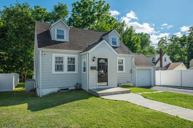 Welcome to this charming Cape Cod-style home offering the perfect blend of comfort, character, and opportunity! Nestled on a level lot, this well-maintained home features public water, public sewer, and natural gas highly sought-after amenities that provide both convenience and peace of mind. Step inside through the welcoming vestibule entrance and into the spacious living and dining area, highlighted by beautiful hardwood flooring and abundant natural light. The updated kitchen features tall maple cabinetry, granite countertops, and ample workspace, making it the heart of the home. Two generously sized bedrooms and an updated full bath complete the first floor. Upstairs, you'll find a private primary suite complete with a full bath and an adjoining flex space that can easily serve as a home office, sitting room, or walk-in closet. The finished basement provides valuable additional living space perfect for a recreation room, home gym, media room, or play area. Outside, enjoy a level backyard and impressive curb appeal enhanced by a newer driveway and Belgium block walkway, both completed just one year ago. A one-car garage adds additional storage and convenience. Move right in and enjoy the many updates already completed while adding your own personal touches over time. Ideally located near shopping, dining, parks, schools, major highways, and NJ Transit transportation options, this home offers exceptional value and endless potential. Don't miss this fantastic opportunity!
