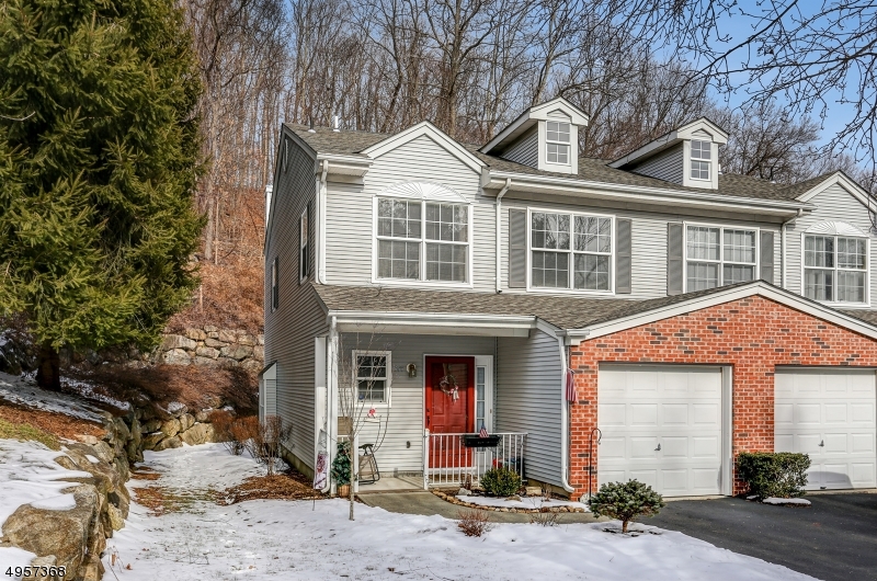 This Two Bedroom end unit townhouse with one car garage is located in Seasons Glen in Mt. Arlington The living area features a living-dining room combo with a fireplace & sliders to the back yard. The kitchen has beautiful Curava recycled glass countertops, an abundance of cabinets and breakfast bar. The upper level with a master bedroom with full bath & walk in closet. 2nd bedroom and den for TV & relaxing. First floor laundry and powder room. Additional storage under the stairs. AC, Furnace, Water Heater and Garage Door Opener are all 2 years old. The community offers an Olympic size Swimming Pool, tennis courts & playground. The clubhouse is complete with a kitchen, billiard room & renovated gym. Excellent commuter location just minutes from RT 80 & Mt Arlington Train Station. Lake Hopatcong is nearby.