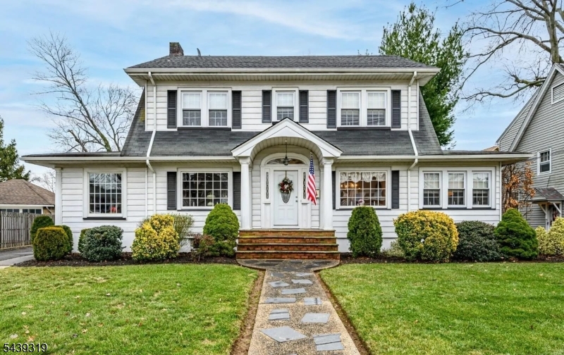 This beautiful home showcases timeless curb appeal with its striking white facade and classic Dutch Colonial gambrel roof. Inside, the expansive living room features pristine original oak hardwood floors with elegant mahogany inlays, centered around a charming brick fireplace that creates the perfect setting for cozy evenings. The updated kitchen offers crisp white cabinetry, high-end stainless steel appliances, and a stunning glass mosaic tile backsplash that adds both style and sophistication. A unique wood-paneled sunroom, ideal as a home office or reading retreat, is bathed in natural light through a wall of oversized windows .The finished lower level is a true highlight, featuring rich espresso-stained wide-plank flooring and a spacious open layout, perfect for a media room, fitness area, recreation space, or playroom. While the home could benefit from some TLC and cosmetic updates to reach its full potential, it offers incredible character, generous living space, and endless possibilities. Located in a peaceful residential neighborhood, this is a wonderful opportunity to create your dream home. Note that the correct lot size is (65x170) 11,050 sq ft. Don't miss out schedule your private showing today!