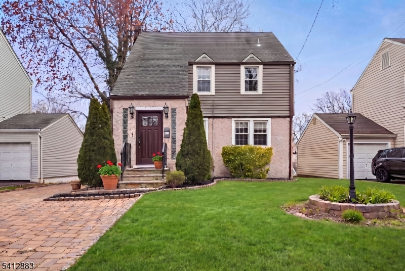 Spacious four bedroom, three full bath Colonial perfectly blends timeless character with modern updates.  A welcoming entrance vestibule leads into a lovely living room and showcases beautiful archways that add warmth and architectural charm throughout the home.  The new kitchen features stylish finishes and thoughtful design.  Newly renovated bathrooms offer fresh, modern comfort.  Enjoy gathering in the formal dining room, perfect for holiday and special occasions.  Upstairs, you will find three spacious bedrooms with ample natural light.  In addition, there is a spacious bedroom en-suite.  Step outside to a large backyard offering endless possibilities for entertaining, relaxing or play.  Move-in condition-just unpack and enjoy!  Close-by to New York City Bus, Jitney to train and houses of worship.