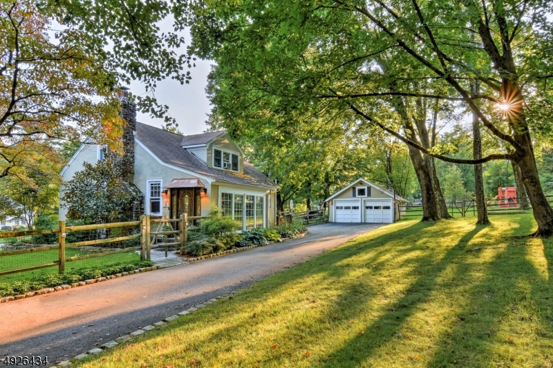 This lovely, well-maintained bungalow style home dates back to 1932, reminiscent of the Craftsman architectural era.  Amazing details wrap this home in delight making it a pleasure to view and a joy to inhabit. A window-lined enclosed porch greats visitors with a sneak preview of the timeless architectural details within.  With its triple window dormer and graceful rooflines, the cottage invokes the ambiance of days gone by. Level one has an oversized living area, quaint DR and newly freshened kitchen, full bath, and bd. Two upper-level bds share a full bath. The partially finished basement offers many flexible living options. The cottage sits on a large, fully fenced corner lot and is conveniently located between Bernardsville and Basking Ridge with transit, shopping and schools.