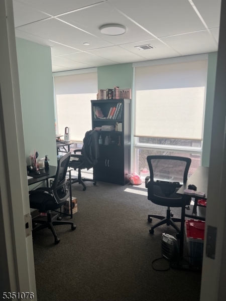 Sitting just outside Hamilton Park, and blocks away from 78 & NJ Transit, this office space offers easy commuter access and walkability to neighboring shops & restaurants. The perfect office space for someone looking to take their work out of the house, or for therapists looking for a more professional setting to meet with clients. This is 1 unit, 11'2" x 10'8", inside of the IPG Counseling Suite. The unit is furnished, as seen in the pics, with access to a communal kitchen, copy room, and bathrooms. This listing is for UNIT #2 within Suite 380.