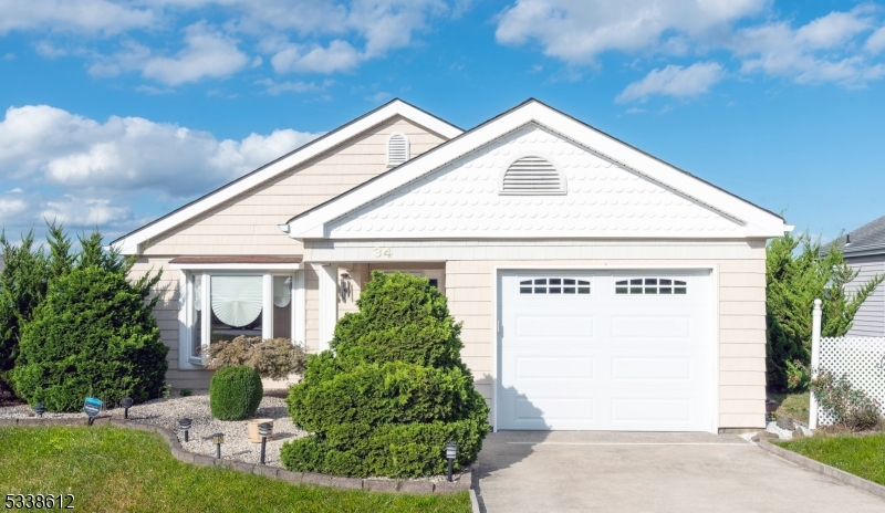Welcome to this well-cared-for Heather model located in the sought-after Leisure Knolls 55+ community. This lovely 2-bedroom, 2 full bath ranch-style home offers comfortable, single-level living with a bright and open floor plan. Enjoy the warmth of hardwood flooring throughout and a spacious living area filled with natural light, thanks to a large bay window. The family room offers a peaceful setting with plenty of sunlight and scenic views ideal for quiet mornings or casual gatherings. The primary bedroom features a generous walk-in closet and updated private en-suite bath, while the second bedroom and full hall bath provide space for guests or hobbies. With ample storage and easy one-level living, this home is perfect for everyday convenience. Step outside to take in the neatly maintained landscaping, all cared for by the community lawn maintenance and snow removal are included. Leisure Knolls offers a wonderful lifestyle with access to a clubhouse, outdoor pool, library, and a variety of social activities and events. Whether you're looking to relax or stay active, this home and community offer the perfect setting. Schedule your tour today and see what makes Leisure Knolls so special!