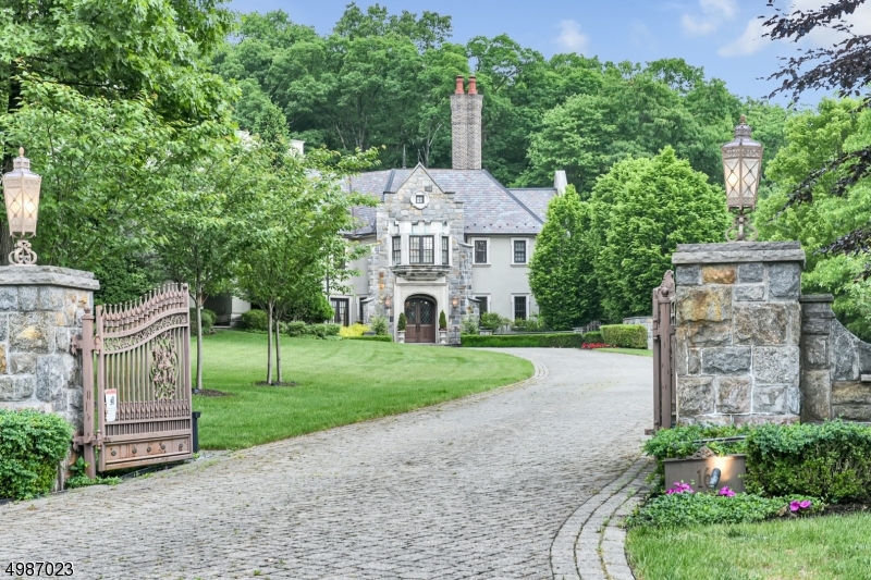 Enter through the gated driveway up to this incredible 7 bedroom, 7 full and 3 half bathrooms estate. Clarence Manor, modeled after the Thomas Kinkade painting ?Beyond Summer Gate? and designed by renown WESKetch Architecture, is situated on nearly 6 acres of lush landscaped property. 1st floor features formal living/dining rooms, modern eat-in kitchen, library/office, bedroom, full bath, powder room & laundry room. 5 additional bedrooms, 4 full baths & a laundry room can be found on the 2nd level. The full, finished lower level has a home theater, exercise room, recreation room, bedroom, full bath & a powder room. The backyard oasis was made for relaxation with its beautiful pool, built-in underground slide & cabana. Crestron system, heated 6-car garage and radiant heating throughout & so much more!