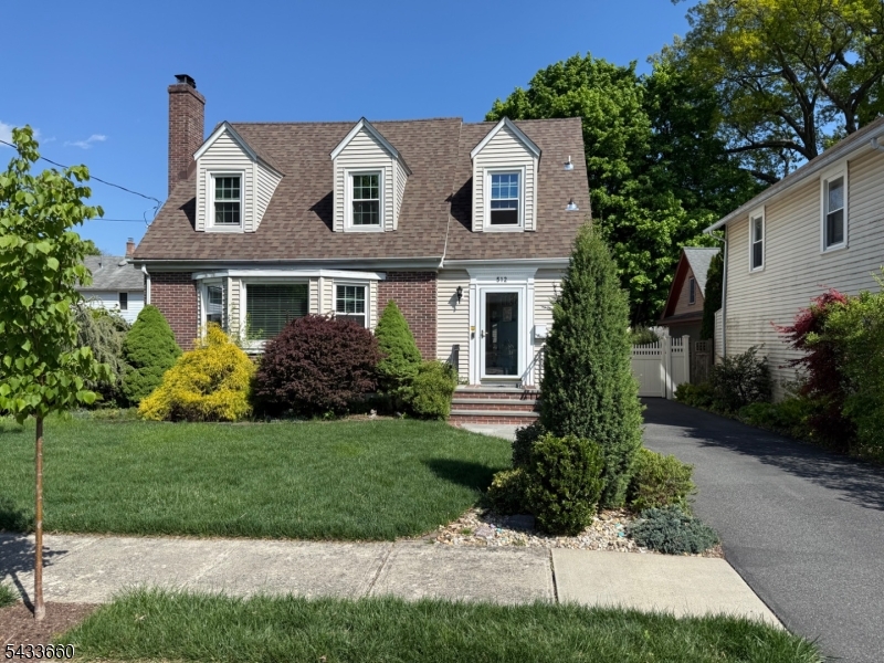 Bright, immaculate and impeccably maintained. This pristine Colonial Cape merges timeless appeal with modern upgrades. The first floor showcases an inviting eat-in kitchen with sliders to a deck overlooking a private fenced yard, a formal dining room with a charming built-in corner china cabinet, a cozy living room with a wood-burning fireplace, a versatile office / den behind French doors and a powder room. You'll find elegant touches like arched doorways, crown moldings and hardwood floors with mahogany inlays. Upstairs are three bedrooms and a refreshed main bath. The full basement offers abundant storage. Completing the picture is an oversized two-car garage with epoxy flooring, plus central air, a newer roof, windows, and tankless boiler. Truly turn key. Ideally located near Route 287, Route 46, Boonton train station and fabulous Boonton Main St.