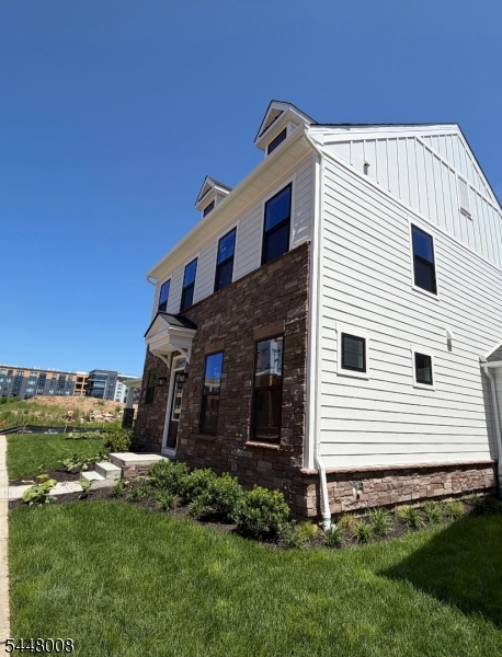 Move this summer into a brand new luxury townhome at PARQ- Morris County's only destination community offering new construction townhomes just 27 miles to NYC!  This highly upgraded home features a finished basement, private 2 car-garage, open concept living, three bedroom suites with private baths, and designer finishes throughout.  Enjoy upgrade recessed lighting, oak stairs, luxury vinyl plank flooring throughout the first floor, providing an elevated look.  Enter through the front door into the formal dining room and continue into the wide open main living area featuring an upscale eat-in-kitchen and large living room.  Your new kitchen includes upgraded white cabinetry, quartz countertops, a tile backsplash, stainless steel appliances including a double wall oven and hooded vent, and large kitchen island.  The living space continues when you go downstairs to the finished basement.  A loft on the second floor greets you when you come up the stairs and 3 spacious bedrooms, each with their own private bathroom and walk-in closet.  Your owner's suite is the most impressive of the bedrooms.  A huge spa-like bathroom features a soaking tub, frameless, tile-surround Roman shower, private water closet, and dual quartz vanity.  This home has it all!