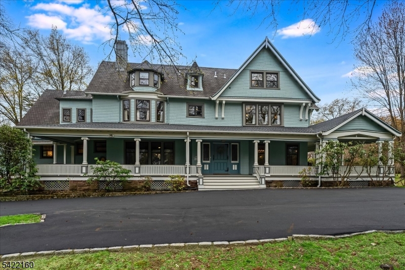 This stately Queen Anne Victorian makes an impression w/ timeless architectural detail, set on 1.8 expansive, park-like acres in sought-after historic Montrose Park. A gracious wraparound porch & dramatic foyer introduce the home's grand proportions, while freshly painted interiors create a bright, updated feel. The spacious eat-in kitchen features granite countertops, butler's pantry & large walk-in pantry w/ W/D hook-up. Historic elegance is abundant throughout including 6 fireplaces & detailed moldings/trim. Multiple living areas including a formal dining room and two family rooms, great for entertaining. Offering 8 bedrooms and 3 multi-use rooms, including a primary suite w/ fireplace & WIC and multiple offices, the home provides exceptional flexibility. 6 full baths & 2 half baths have been enhanced including the powder room that has been fully refreshed w/ new tile & fixtures. The lower level features newly finished rooms, a dedicated gym w/ TV, a wine cellar & full bath. Additional upgrades include updated overhead lighting, convenient 2nd floor laundry, refinished sunroom flooring, in-ceiling speakers in kitchen & dining room & new boiler. Major exterior improvements include partial roof replacement, new 3 car garage, new car charger, new fire pit, new fence, new front porch steps & railings, repaved circular driveway & full exterior painting. A rare opportunity to own a distinctive, move-in ready home that seamlessly combines historic charm w/ meaningful updates.