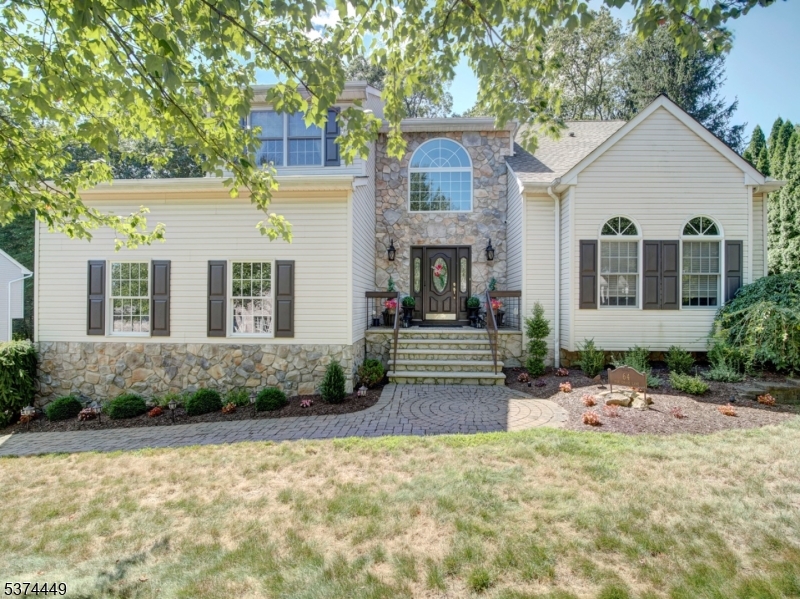 This gorgeous home is the perfect blend of elegance, sophistication, comfort & style. It showcases a designer flare w neutral palette.This 4 bdrm, 2.5 bath beauty has it all! Grand 2 story foyer entrance will WOW you upon entry. The renovated expansive gourmet kitchen will impress all. It features a 15' island with prep sink, seating, granite countertops, tiled backsplash, stainless steel appliances, exceptional counter space, pantry closet, separate dining area & sliding doors that leads to expansive composite deck overlooking tree lined, private yard. Experience the blend of extensive millwork displayed thoughout this home which adds character & style. Host your next dinner party in the formal dining rm that provides a lovely ambiance. It boasts a vaulted ceiling w wood beams & impressive stone wall. The family rm is perfect for entertainment & features a beautiful gas fireplace w gorgeous mantle & marble surround. Ascend to 2nd floor to primary suite featuring large walk in, California style closet & renovated bath with dual vanity, stall shower & soaking tub. 3 other bdrms & main bath complete this level. This gem offers peace of mind featuring a NEW ROOF, solar panels on back of house for discounted energy & public utilities. Basement has extra foot to ceiling and is ready to be finished Other features include all wood floors on 1sr flr, alarm sys, underground sprinkler system, updated lighting, recessed lighting, updated baths, 2 car side garage & shed in yard