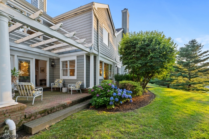 Serene and private location, nestled on hill off Whippany Rd, this Woodcrest townhouse unit offers a classic design with 2-story open floor plan, vaulted ceilings, french door to patio and more. Relax by the fireplace or sit for a quiet read on the patio under the pergola...Lovely multi-floor townhouse with hardwood floors, open living room, dining room and family room complement by vaulted ceilings and lots of windows. Eat-in kitchen off entrance foyer, french doors to patio area, fireplace in family room, plus access to garage and finished basement from main level. Upper level offers master bedroom en suite, additional full bath and guest bedroom. Full finished basement, utility room and lots of storage.Perfect access to airport, trains, transit and major highways. Seconds to the Arboretum and Library.