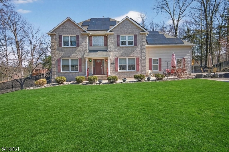 Spacious 4/ 5 BR Colonial in Hidden Valley, Sprawling 3 AC.  level & fenced lot. You are greeted by a large paver stone driveway, Hardwood on 1st floor. 2 Story Foyer & custom lighting. Kitchen features, Center island w/sink, SS Appliances. &  Wine Fridge, Pantry , Maple Cabinets. The family room has a Gas Fireplace, Spacious deck, French doors in the living room. Formal Dining Room. This home has 2 elevators with wheelchair access to all levels.  Primary Bedroom features a tray ceiling, a jetted tub, plus shower and two walk-in closets.Large  Finished office or bedroom over the garage, Water Filtration system.& Softener. The Lower level has a Theater Room which is includes all equipment. Extra guest room or home office.  Half bath in storage room. Generac Generator.