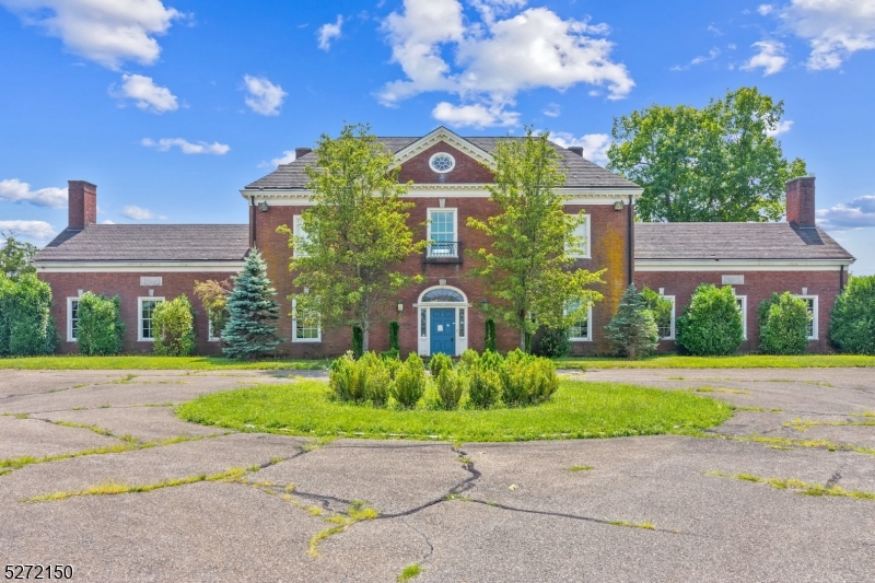 Step into a piece of American history with this exceptional Bedminster estate, a timeless treasure from 1924, originally known as "Field House." Spanning nearly 123 acres of rolling hills and bordered by classic white fencing, this property is a haven for equestrian enthusiasts, offering unparalleled privacy and scenic beauty just minutes from I-78.The grand Georgian Manor, inspired by Williamsburg's governor's mansion and crafted with bricks from John D. Rockefeller, boasts 27 rooms across approximately 13,500 sq. ft. Designed by the esteemed Cross and Cross, this home exudes elegance with its high-quality construction, rich wood finishes, central air , and a 3-story dumb waiter. Enjoy stunning views through strategically placed custom windows, a fully finished attic, and a sophisticated wine cellar.The estate features multiple barns with over 55 stalls , extensive equestrian amenities, and three cottages with eight separate living quarters, providing ample space for guests, staff, or rental income. With preserved farmland and a setting surrounded by other protected estates, this property offers both a luxurious lifestyle and a unique investment opportunity.  Bank employees, individual insiders, impacted 3rd party/vendors and their household members are prohibited from purchasing.